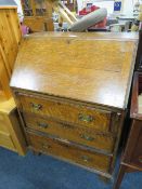 A 20TH CENTURY OAK BUREAU