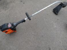 A FLYMO MAXI TRIM PETROL STRIMMER
