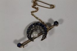 A YELLOW METAL VICTORIAN CRESCENT SHAPED BROOCH SET WITH SAPPHIRES, DIAMONDS AND CENTRAL PEARL