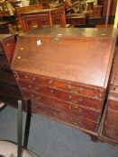 A 19TH CENTURY OAK COUNTRYMADE BUREAU - 'ST MARYS ABBEY'