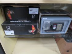 A BOX OF BOXED TONER CARTRIDGES AND A BOXED DIGITAL SAFE