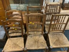 A set of four antique oak wicker Lancashire style chairs together with two further wicker seat