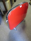 A VINTAGE RETRO STYLE RED ENAMEL HEATER - FOR DISPLAY PURPOSES ONLY