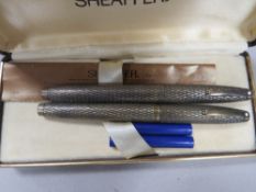 TWO SHEAFFER STERLING SILVER FOUNTAIN PENS