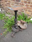 A CAST IRON TABLE PEDESTAL LEG, TOGETHER WITH A TROUGH/ PLANTER