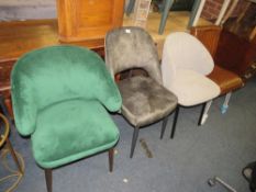 A collection of five modern upholstered dining chairs to include one brown leather example