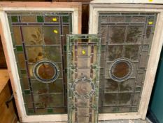 Three 20th century vintage leaded, glazed light panels with floral and bird detail (Two framed)