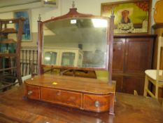 A regency mahogany inlaid dressing mirror with three drawers