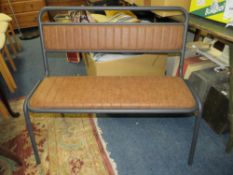A modern industrial metal and leather style bench