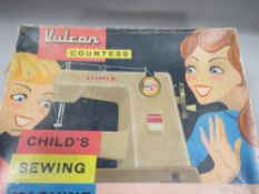 A VINTAGE VULCAN COUNTESS CHILDS SEWING MACHINE IN ORIGINAL BOX