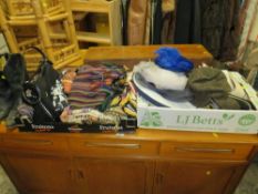 A collection of vintage textiles, hats, pair of cowboy boots, etc.