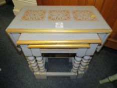 A NEST OF PAINTED OAK TABLES