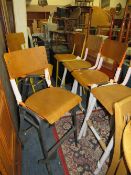 A modern harlequin set of seven industrial style bar/kitchen stools