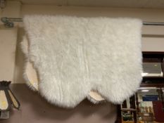 A large show home, modern sheepskin style rug approx 220 x 140 cm