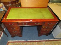 A modern mahogany reproduction, green leather top, twin pedestal desk W 121 cm