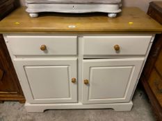 A modern kitchen style dresser base with two drawers and cupboards below as found