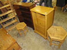 A modern multi drawer cabinet with two open bookcases and two bamboo tables