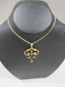 AN ANTIQUE PENDANT MARKED 9ct