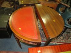 Two modern mahogany half moon side tables