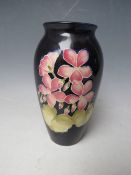 A MOORCROFT FLORAL PATTERN BALUSTER VASE, H 19 cm