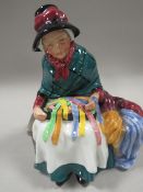 A ROYAL DOULTON FIGURINE 