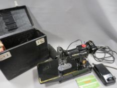 A CASED SINGER 222K AND ACCESSORIES