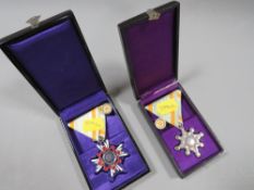 TWO JAPANESE MILITARY MEDALS, ORDER OF THE SACRED TREASURE 5th & 6th CLASSES IN FITTED CASES (2)
