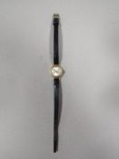 A HALLMARKED 9 CARAT GOLD CASED MEDANA WRIST WATCH