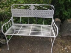 A WROUGHT IRON GARDEN BENCH