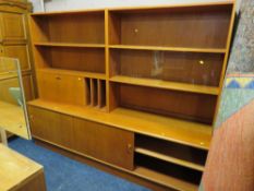 A large teak mid-century wall display unit