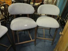 A pair of harlequin upholstered bar/kitchen stools