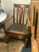 A heavy carved oak armchair