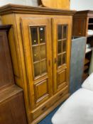 A 20th century, heavy oak glazed display cupboard with single drawer below H 195 cm W 132 cm