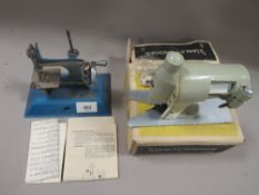 A LITTLE BETTY TIN PLATE SEWING MACHINE TOGETHER WITH A BOXED STANLEY ATTACHMENT