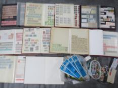 TWO BOXES CONTAINING TWENTY BRITISH STAMP ALBUMS AND STOCK BOOKS, together with loose British stamps