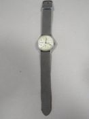 A MOVADO, 1940'S TRIPLE CALENDAR WRISTWATCH WITH STAINLESS STEEL CASE.