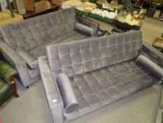 A pair of modern upholstered three seater settees