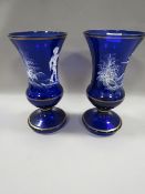 A PAIR OF BLUE GLASS MARY GREGORY STYLE VASES