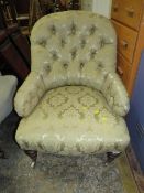 An Edwardian mahogany upholstered armchair