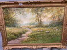 HILARY SCOFFIELD - A GILT FRAMED OIL ON CANVAS, LANDSCAPE WITH SHEEP 64 cm x 90cm