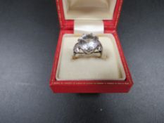 A LARGE SOLITAIRE RING MARKED 9ct