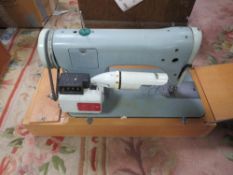 FOUR ASSORTED SEWING MACHINES TOGETHER WITH AN OVERLOCK MACHINE - ALL AS FOUND