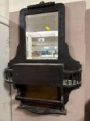 An Edwardian mirrored shelf with glazed panel