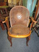 A vintage bergere armchair