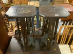 A pair of carved oak plant stands