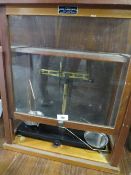 A SET OF GRIFFIN AND GEORGE CHEMIST SCALES IN A DISPLAY CASE