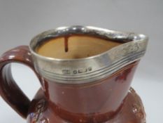 A HALLMARKED SILVER TOPPED LAMBETH STYLE HUNTING JUG