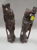 A PAIR OF ORIENTAL STYLE CARVED HARDWOOD FIGURES