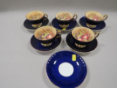 FIVE AYNSLEY 'ORCHARD GOLD' CABINET CUPS AND SAUCERS - DARK BLUE - SIGNED TOGETHER WITH A SPARE