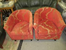 A pair of modern red patterned upholstered tub style armchairs